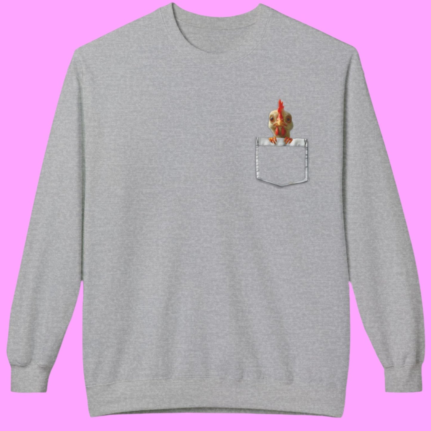 a light gray sweatshirt has a printed front pocket with an orange young chicken sticking its head and front claws out of the pocket. Pocket Pals! Only from The Curated Goose