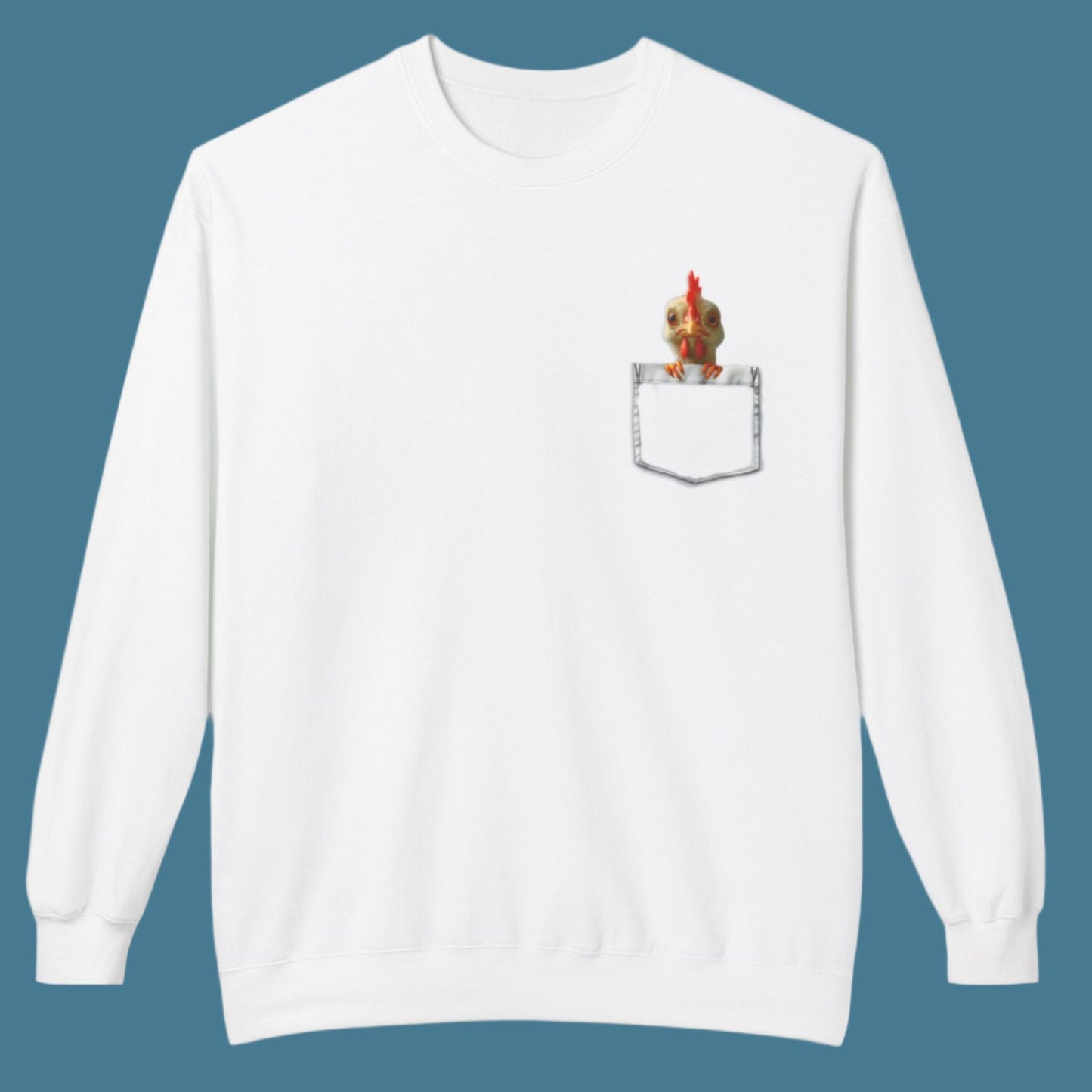 a white sweatshirt has a printed front pocket with an orange young chicken sticking its head and front claws out of the pocket. Pocket Pals! Only from The Curated Goose